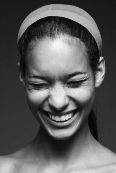 black and white photograph of a smiling woman