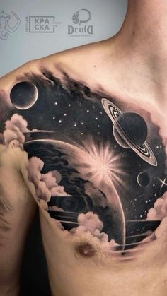 a man's chest with planets and stars on it