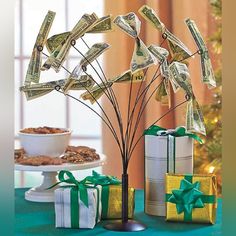 the money tree has been decorated with dollar bills and is ready to be used as a centerpiece