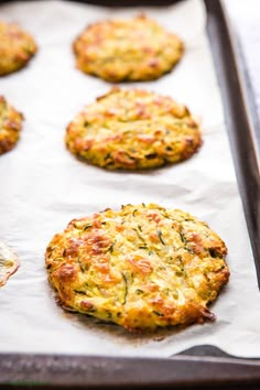 freshly baked crab cakes on a baking sheet ready to go into the oven in the oven