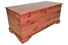 a large wooden chest sitting on top of a white background