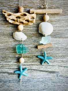 sea shells and starfish hangings on a wooden table