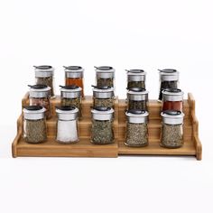 an assortment of spices and seasonings on a wooden tray