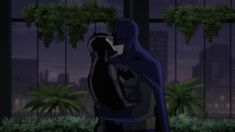 batman and catwoman hugging in the dark