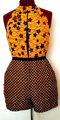 African Clothing: Sia Romper/Jumpsuit. This colorful romper with a plunging neckline will have you standing out at any party. Ankara | Dutch wax | Kente | Kitenge | Dashiki | African print bomber jacket | African fashion | Ankara bomber jacket | African prints | Nigerian style | Ghanaian fashion | Senegal fashion | Kenya fashion | Nigerian fashion | Ankara crop top (affiliate) Nigerian Fashion Ankara, Colorful Romper, Ghanaian Fashion, Afrikaanse Mode, African Fashion Ankara, Nigerian Styles