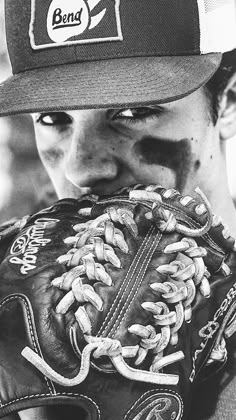 a baseball player wearing a catchers mitt with his face covered in dirt and mud