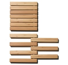 four pieces of wood sitting on top of each other in front of a white background