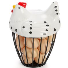 a chicken cage with eggs in it on a white background