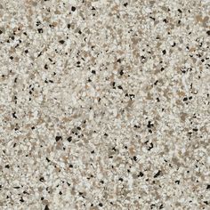 a close up view of the surface of a counter top with black and white speckles