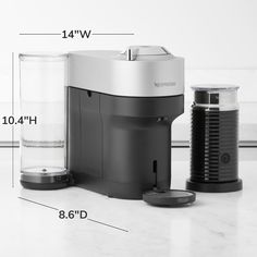 a coffee maker with measurements for the top portion and bottom portion, on a marble countertop