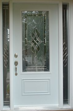 a white front door with glass panels on it