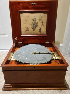 an antique record player in its wooden case