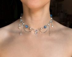 This handmade beaded Blue Fairy Necklace is made with glass, acrylic, and resin beads, with stainless steel chains.  ✧ Size: 12 inches with a 2-inch extender (adjustable to 14 inches). Perfect for those with a petite neck. If you need a larger or smaller size, message me with your desired measurements! I can add more beads and/or a second extender.  ✧ Closure: Lobster claw ✧ Care: For longevity, please keep away from water and perfumes. If you have any questions, feel free to reach out ♡ For more, visit my shop: https://www.etsy.com/shop/stardropstop Fairy Beaded Necklace, Necklace Fairycore, Cottagecore Jewelry, Diy Necklaces, Y2k Necklace, Beaded Necklace Patterns, Princess Necklace, Silly Goofy, Princess Core