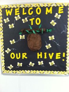 a welcome to our hive sign hanging on the wall