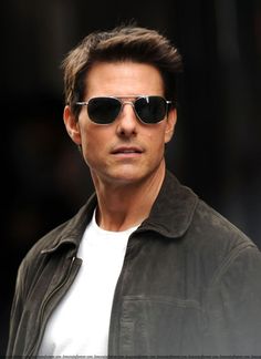 a man wearing sunglasses is looking at the camera