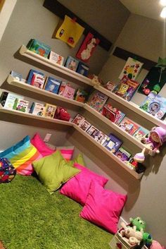 a child's bedroom with bookshelves and stuffed animals on the bed in it