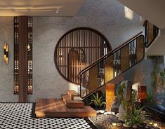 an indoor area with black and white tile flooring, wooden railings and round window