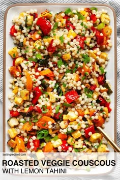 roasted veggie couscous with lemon tahitii on a white plate