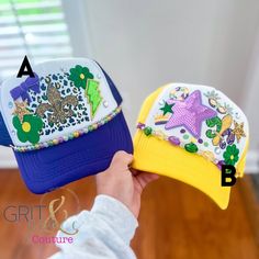 Mardi Gras Trucker Hat- Mardi Gras Hat- Parade Hat- Mambo Hat - Gift for Women- Louisiana Mardi Gras STYLE One of each available. Trucker hats include embroidery patches, DTF graphics and chains. PROCESSING Hats are completed and ready to ship!  SHIPPING This item qualifies for free shipping! Your order will ship USPS first class. This takes 2-5 additional business days. You should receive an email when your order has shipped which will include tracking information. *GRIT and Grace Couture is not responsible for wrong addresses, lost packages, or stolen packages. Please double check address upon check out.* RETURN POLICY No returns or exchanges. Please don't hesitate to ask any questions prior to making your purchase. If you have a concern about your order, please get in touch with us. We Mardi Gras Hat, Mardi Gras Hats, Louisiana Mardi Gras, Mardi Gras Parade, Grit And Grace, Mardi Gras Carnival, Mambo, Embroidery Patches, Trucker Hats