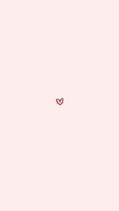 a pink wall with a heart drawn on it