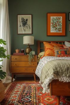 a bed room with a neatly made bed and pictures on the wall