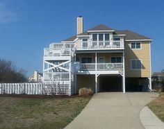 an apartment building with two balconies on the second floor