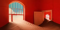 an open door leading to a red room with sand dunes in the foreground and a window on the far wall