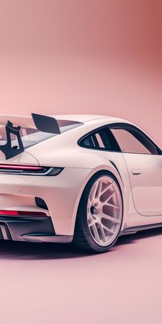 a white sports car on a pink background