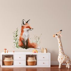 a toy giraffe next to a wall with a painting of a fox on it