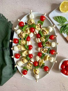 caprese tortellini skewers with balsamic glaze on a plate