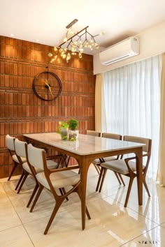 the contemporary table and chairs are arranged in front of a brick wall with white drapes