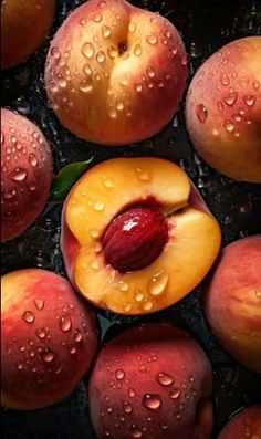 several peaches with water droplets on them