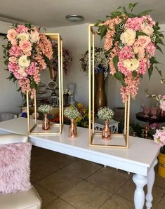 three mirrors with flowers in them on a table