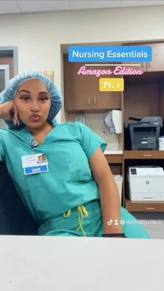 a woman in scrubs sitting at a desk with her hand on her head and looking off to the side