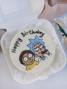 a birthday cake with the characters rick and mort on it, sitting in a plastic container