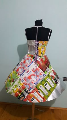 a dress made out of wrapping paper on a mannequin