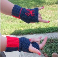 two hands with red and blue crocheted wrist warmers on them, one is holding the other hand