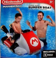 the nintendo mario kart bumper boat has two boys on it and is in the water