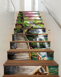 this is an image of stairs leading up to a waterfall in the woods with flowers on them