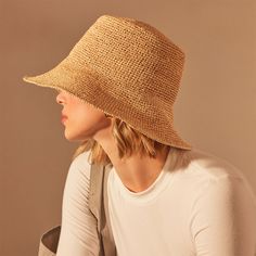 Crochet Bucket Hat made from soft woven raffiaAdditional Information:• Material: 100% Raffia• Measurements: Crown: 4", Brim: 3"• One size fits most Natural Woven Cloche Hat With Short Brim, Natural One Size Straw Hat For Spring, Natural Color Sun Hat One Size, Bohemian Crochet Hat In Toquilla Straw, Casual Handwoven Hats For Spring, Beige Handwoven Crochet Hat For Spring, Natural Woven Short Brim Cloche Hat, Bohemian Crochet Toquilla Straw Hat, Beige Handwoven Crochet Hat With Short Brim