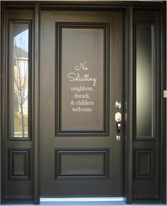 the front door to a house with two sidelights and a sign that says no solicizing neighbors, friends, and children