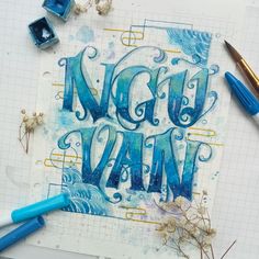 the words night van written in blue ink on a piece of paper next to some watercolor