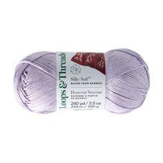 a ball of yarn that is purple and has the words silky soft written on it