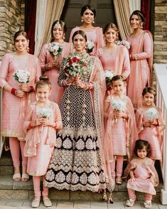 a bride and her bridal party posing for a photo