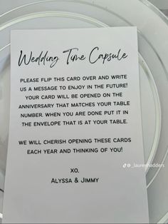 a wedding table card on a glass plate