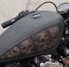 a motorcycle with skulls painted on it's side