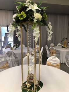 the centerpiece is adorned with white flowers and greenery, along with other decorations