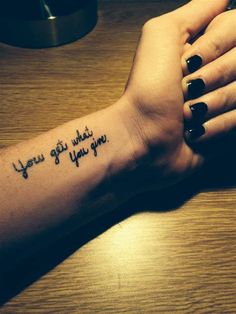 a woman's arm with a tattoo that says, you are what you want