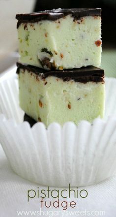 three pieces of cake sitting on top of a white paper plate next to each other