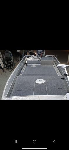 the inside of a boat that is being used as a storage area for other boats